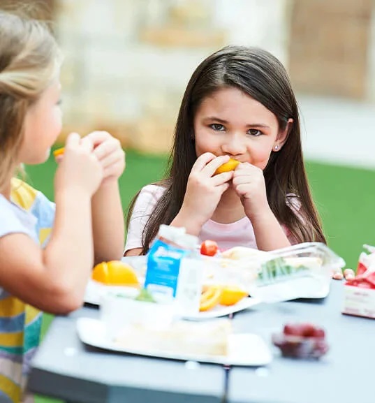 students eating fruit